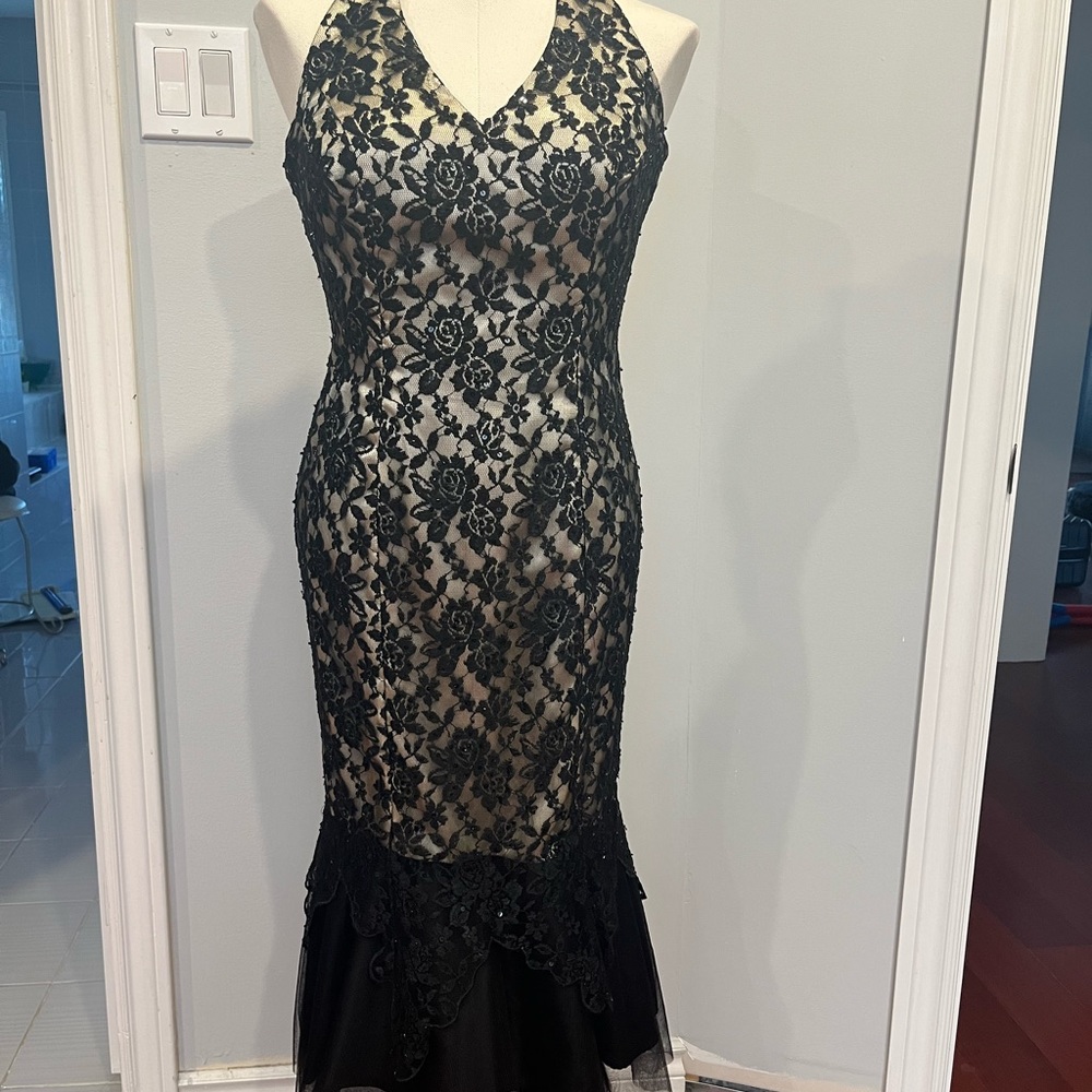 Halter Nude dress with Black lace overlay. Sequins details adorned throughout .